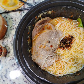 ShiFu Noodle - Beef brisket with rice noodles and some soup to give volume, topped with chili oil - Szechuan Near Me - San Antonio, Texas ShiFu Noodle - Beef brisket with rice noodles and some soup to give volume, topped with chili oil - Szechuan Near Me - San Antonio, Texas