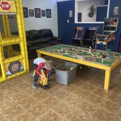 33's Barber Shop - Train table and school bus are among a few of the toys!