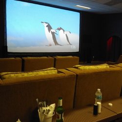 Brevard Cinema House - Screen, back of chairs, everyone gets a table.