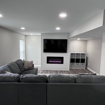 Prestige Construction - a living room with a couch and tv - Roofing Near Me - Valparaiso, Indiana