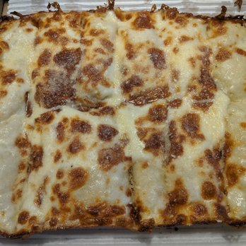 Two Guys Pizza Pies - Small cheese bread glistening with grease (a good thing). - Pizza Near Me - Livonia, Michigan Two Guys Pizza Pies - Small cheese bread glistening with grease (a good thing). - Pizza Near Me - Livonia, Michigan
