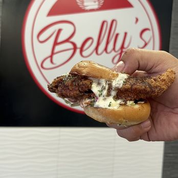Belly's Sliders & Wings - a hand holding a sandwich - Food Trucks Near Me - Carson, California