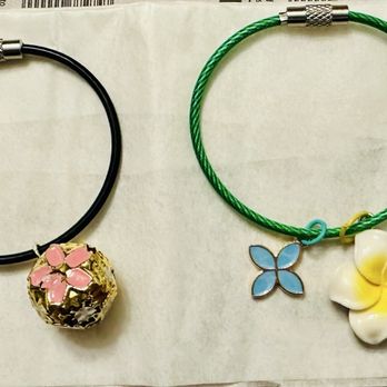 Creations By You - My bag charms using the sakura bell and plumeria charms from Creations by You. - Arts & Crafts Near Me - Honolulu, Hawaii