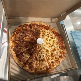 Half bacon and half plain cheese pizza Half bacon and half plain cheese pizza