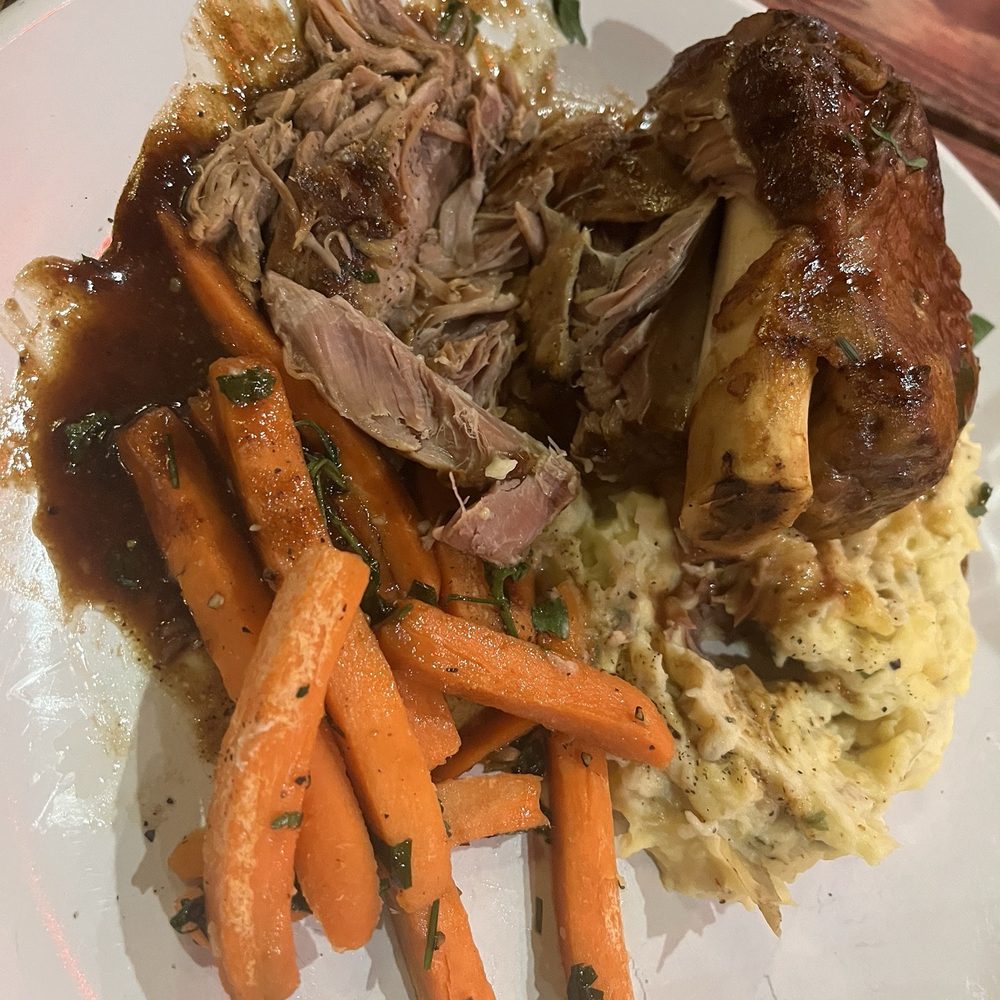 Modern Chop Steakhouse - Pork shank with mashed potato and carrots - Steakhouses Near Me - Bradenton, Florida