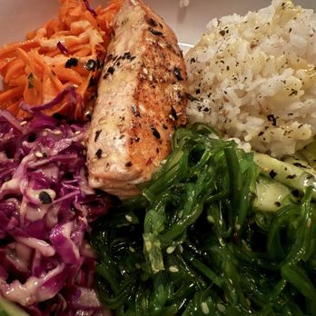 Basic Kitchen - SALMON BOWL grilled salmon, carolina gold rice, marinated cabbage, carrot ginger salad, cucumber, seaweed, furikake, orange miso sauce - New American Near Me - Charleston, South Carolina
