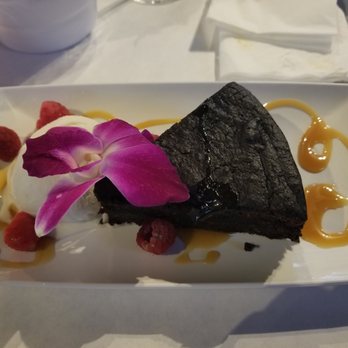 Yah Mon - Rum cake with rum raising ice cream...too strong a raisin flavor for my taste - Caribbean Near Me - Tampa, Florida Yah Mon - Rum cake with rum raising ice cream...too strong a raisin flavor for my taste - Caribbean Near Me - Tampa, Florida