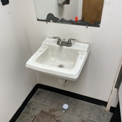 Shell - Men's bathroom. No towels and broken soap bottle on floor. Nasty place.