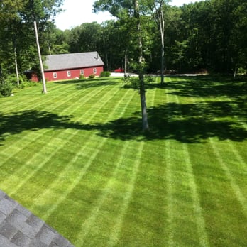 Giroux Landscaping - a green lawn with a red barn in the background - Landscaping Near Me Giroux Landscaping - a green lawn with a red barn in the background - Landscaping Near Me