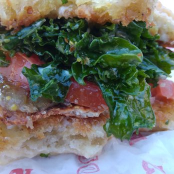 Kale Cafe Juice Bar & Vegan Cuisine - My chik'n patty is thinner than the tomato slice!  I got ripped off today. - Vegan Near Me - Daytona Beach, Florida