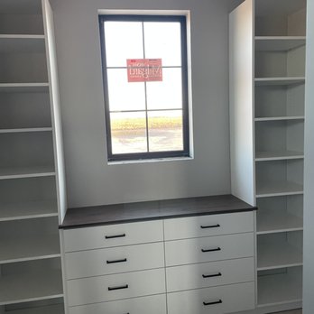 Closet Factory - Walk in closet in white melamine with Luxent countertop and mate black handles. - Interior Design Near Me - hurricane, Utah Closet Factory - Walk in closet in white melamine with Luxent countertop and mate black handles. - Interior Design Near Me - hurricane, Utah
