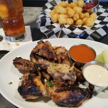 Wicket Door Pub - Chicken wings, side of tater tots and an iced tea with lemon - Pubs Near Me - Ashburn, Virginia Wicket Door Pub - Chicken wings, side of tater tots and an iced tea with lemon - Pubs Near Me - Ashburn, Virginia