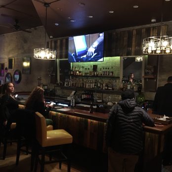 Snifters Tapas & Spirits - people sitting at the bar - Tapas/Small Plates Near Me - Milwaukee, Wisconsin Snifters Tapas & Spirits - people sitting at the bar - Tapas/Small Plates Near Me - Milwaukee, Wisconsin