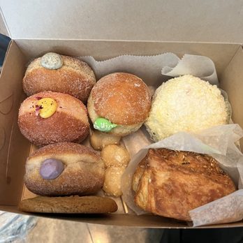 Rose Ave Bakery - Passion fruit, pandan coconut, black sesame and ube donuts. Saigon cinnamon banana cookie, garlic scallion bun, coconut mochi puffs. - Bakeries Near Me - Washington, DC, District of Columbia