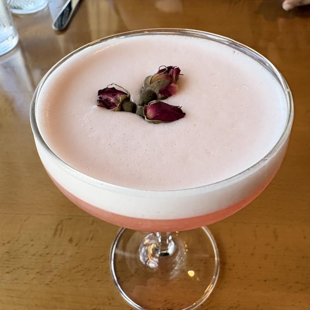 flower power cocktail with rosebud garnish flower power cocktail with rosebud garnish