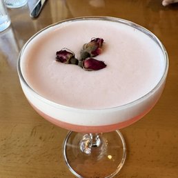 flower power cocktail with rosebud garnish