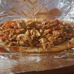 Chicken cheesesteak with provolone, fried onions, and sweet peppers. Never a disappointment.