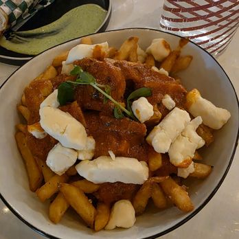 The Roaring Rolls - Butter chicken poutine - Indian Near Me - Canmore, Alberta