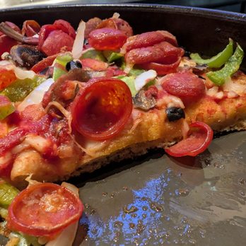 BJ's Restaurant & Brewhouse - The New BJ's Favorite - Why is the crust only 1/5 of the pan width? - Breweries Near Me - Huntington Beach, California