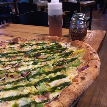 Pure Pizza - Classic pesto pizza with peppers, onions, and pepperoncini. - Pizza Near Me - Charlotte, North Carolina Pure Pizza - Classic pesto pizza with peppers, onions, and pepperoncini. - Pizza Near Me - Charlotte, North Carolina