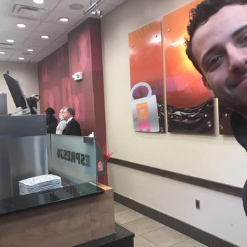 Dunkin' - a man smiling in a restaurant - Donuts Near Me - Philadelphia, Pennsylvania Dunkin' - a man smiling in a restaurant - Donuts Near Me - Philadelphia, Pennsylvania