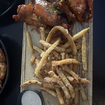 Emerson's Ale House - Hot Honey Wings with Parmesan Truffle Fries - Bars Near Me - Mount Prospect, Illinois Emerson's Ale House - Hot Honey Wings with Parmesan Truffle Fries - Bars Near Me - Mount Prospect, Illinois