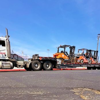 Mid Island Towing - We have a tri axle Landoll trailer for all your heavy equipment needs. - Towing Near Me - Nanaimo, British Columbia Mid Island Towing - We have a tri axle Landoll trailer for all your heavy equipment needs. - Towing Near Me - Nanaimo, British Columbia