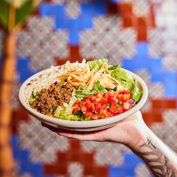 Chuy's - TACO SALAD Fresh salad mix w/tortilla strips, cheese, guacamole, tomatoes. Choice of fajita chicken, fajita beef or seasoned ground beef - Tex-Mex Near Me - Fairfax, Virginia
