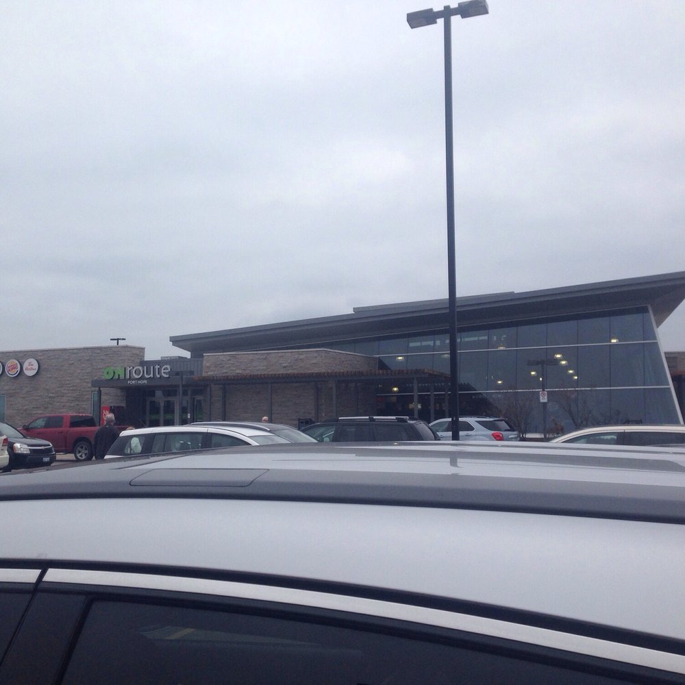 cars parked in front of a tim hortons store cars parked in front of a tim hortons store