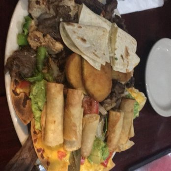 Costa Mesa - a plate of food on a table - Mexican Near Me - Mcallen, Texas