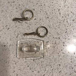 Triangle Appliance Service - Tiny tiny sick on hook to hold up this green curtain