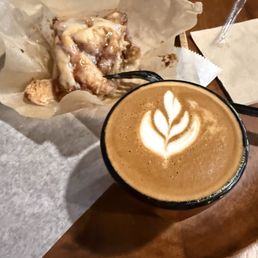 Cortado and cinnamon roll.