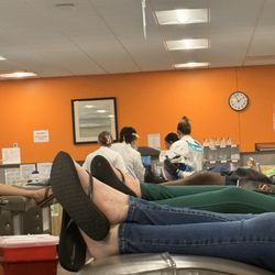 BioLife Plasma Services - Staff sitting laughing and chatting