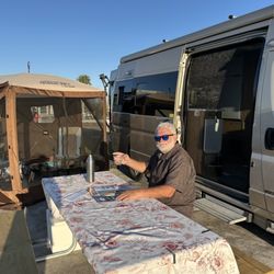 Pine Island KOA-Ft Myers - Wayne at the table - you can kinda see how congested things are