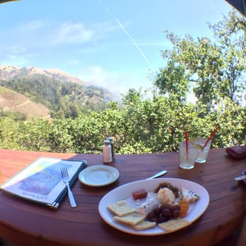 Nepenthe - Enjoying the view at our table with the cheese plate and Moscow mules. - New American Near Me - Big Sur, California