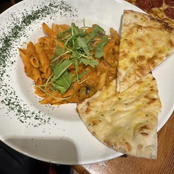 Il Padrino Restaurant - Penne Arrabbiata with garlic bread - Wine Bars Near Me - Cork, Colorado