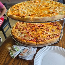 Buffalo chicken pizza and pepperoni pizza. Buffalo chicken pizza and pepperoni pizza.
