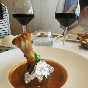 Rasika - The new lamb shank dish with silver flake. Not sure the silver added anything to the dish, the sauce was out of this world. - Indian Near Me - Washington, DC, District of Columbia