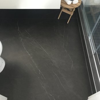 AIS Repairs & Renovations - Large dark floor tile. - General Contractors Near Me
