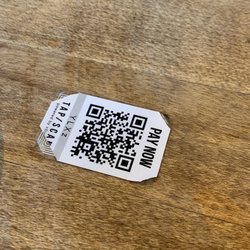 Moxies Gloucester Restaurant - Pay now sticker on the table