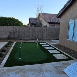Landscaping Professional Service - Finished, a very nice backyard with desert plants, rocks, planter, Turf and Golf.