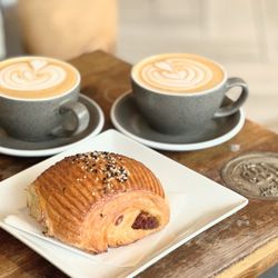 Grinder’s Coffee Bar - Latte and sausage kolache