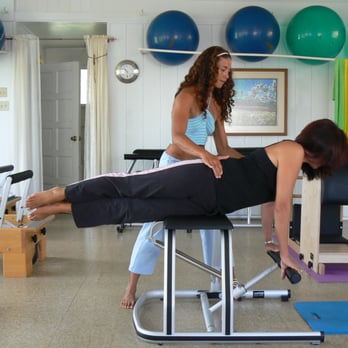 Poise Pilates - Theresa instructing a client on the Wunda Chair. - Pilates Near Me - Kalaheo, Hawaii Poise Pilates - Theresa instructing a client on the Wunda Chair. - Pilates Near Me - Kalaheo, Hawaii