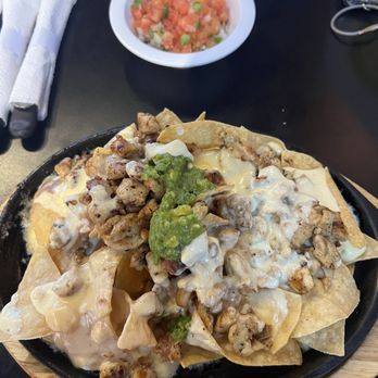 Chile Poblano Mexican Grill - Chicken nachos served very hot in a skillet - Mexican Near Me - Moapa Valley, Nevada Chile Poblano Mexican Grill - Chicken nachos served very hot in a skillet - Mexican Near Me - Moapa Valley, Nevada