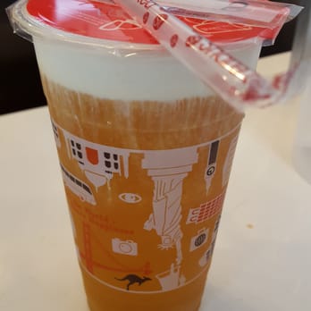 Photo of Sharetea - Cerritos, CA, United States. Mango green tea creama, 80% sweet. I didn't realize that they provide plastic knives for the odd cream-sipping routine.