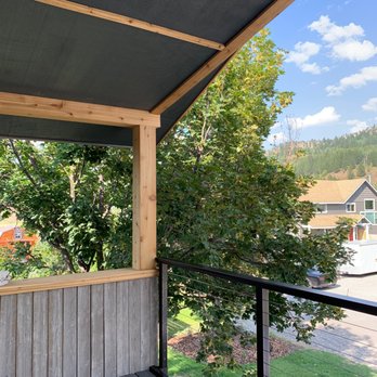 Vulcano Remodeling - barwood siding, cedar wrapped posts, trim, cable handrail - Siding Near Me Vulcano Remodeling - barwood siding, cedar wrapped posts, trim, cable handrail - Siding Near Me