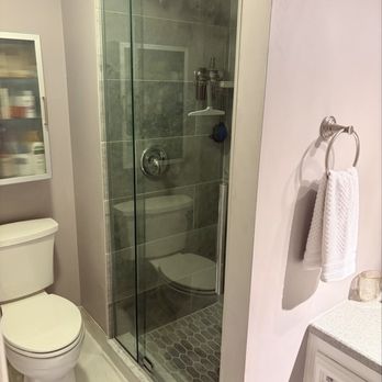 Alpha Omega Home Remodeling - new pivot shower door w/ fully redone stall - General Contractors Near Me - Bloomingdale, Illinois Alpha Omega Home Remodeling - new pivot shower door w/ fully redone stall - General Contractors Near Me - Bloomingdale, Illinois