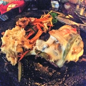 Grotto - Dry aged NY strip steak, topped with mushrooms, onions and sweet red peppers. - Italian Near Me - Syracuse, New York Grotto - Dry aged NY strip steak, topped with mushrooms, onions and sweet red peppers. - Italian Near Me - Syracuse, New York