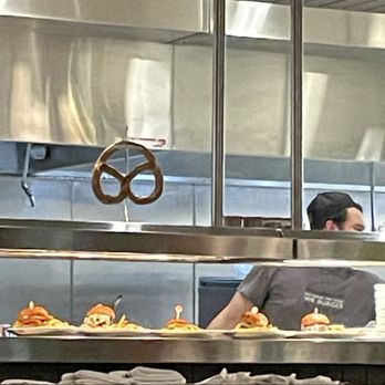 Hyatt Regency Reston - Delicious burgers and a giant pretzel ready for serving. - Hotels Near Me - Reston, Virginia