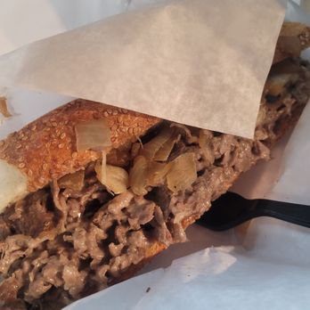 Uncle Gus' Steaks - Cooper Sharp, onions, sesame seed roll - Cheesesteaks Near Me - Philadelphia, Pennsylvania Uncle Gus' Steaks - Cooper Sharp, onions, sesame seed roll - Cheesesteaks Near Me - Philadelphia, Pennsylvania